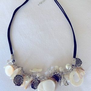 She’ll and silver charm necklace
